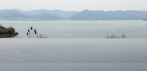 a view of a body of water and mountains