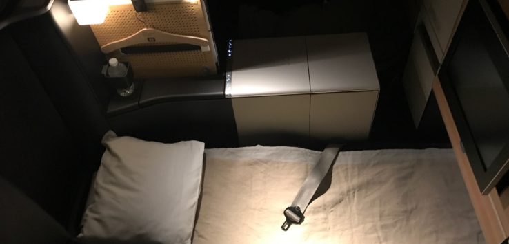 a seat belt on a bed