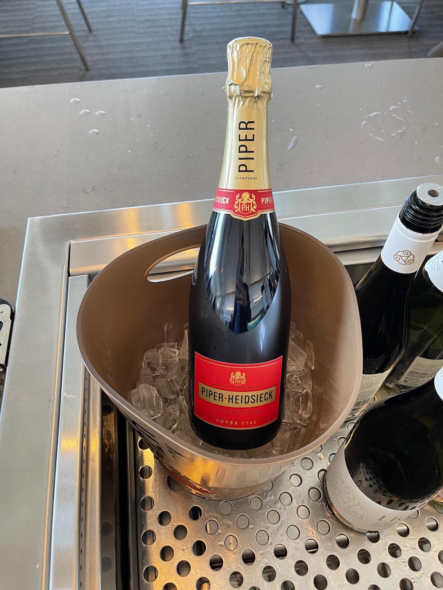 a bottle of champagne in a bucket of ice