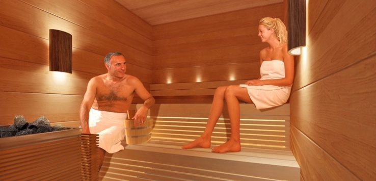 a man and woman in a sauna
