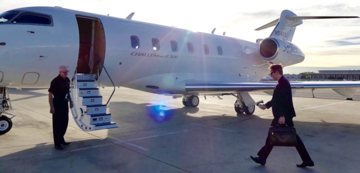 a man walking towards an airplane