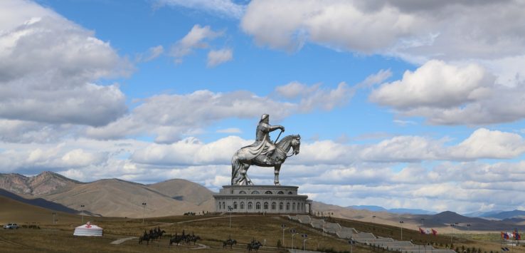 a statue of a man on a horse on a hill