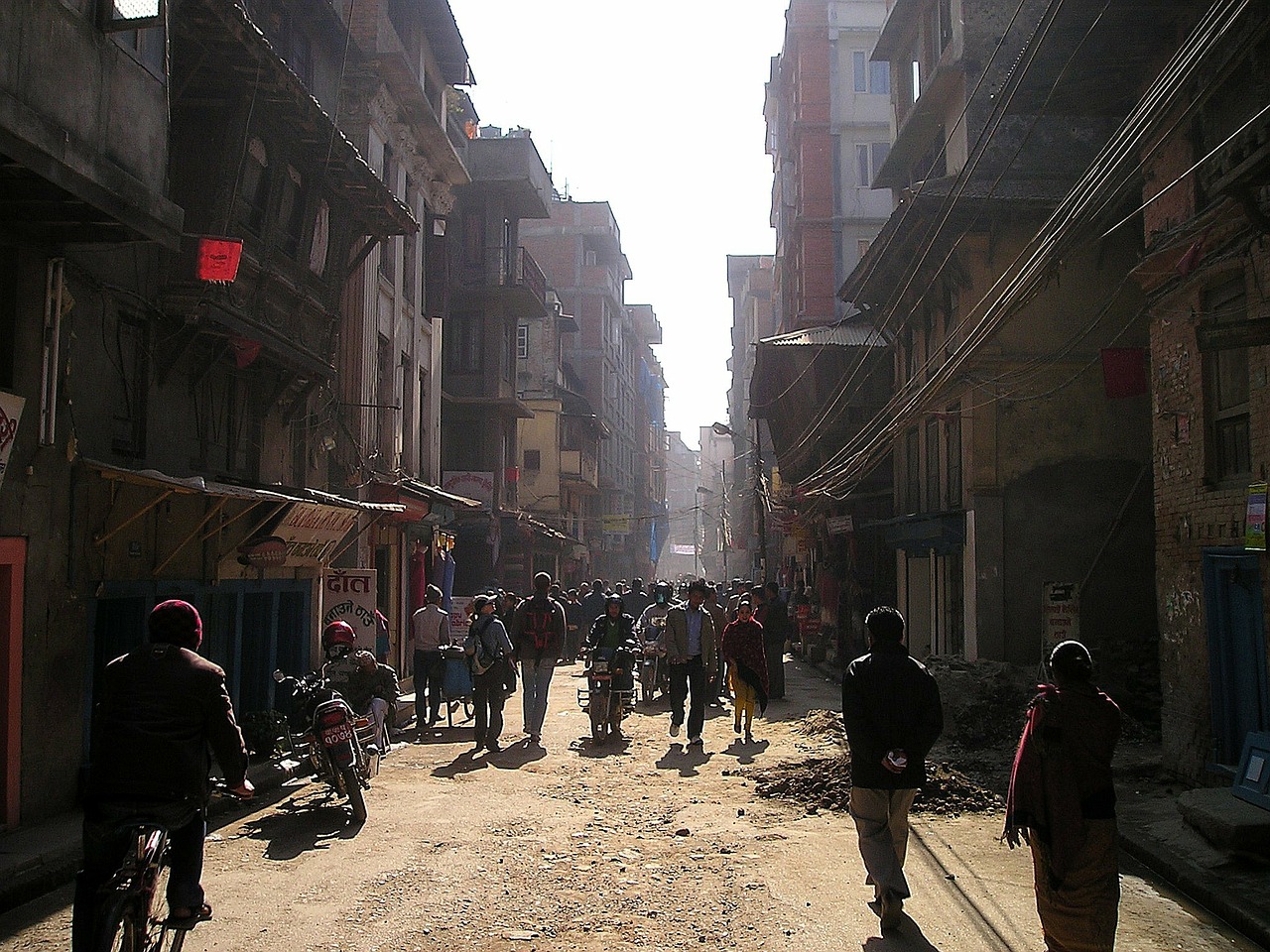 a group of people walking down a street