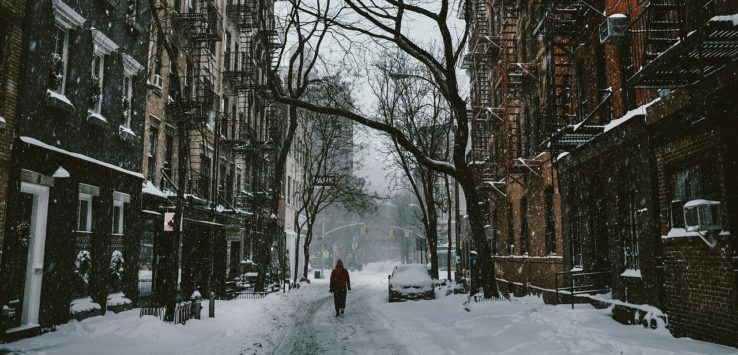 a person walking on a snowy street