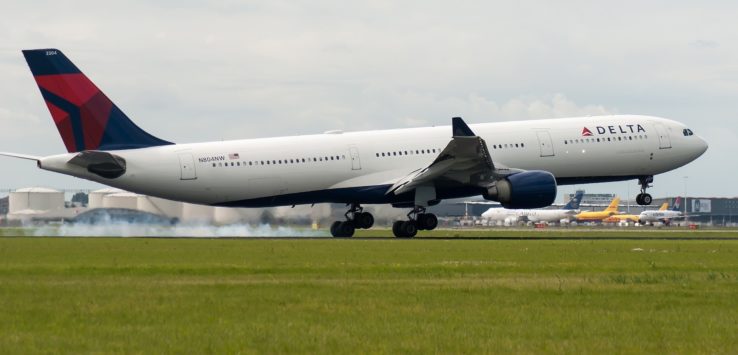 a large white airplane on a runway