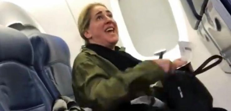 a woman sitting in an airplane