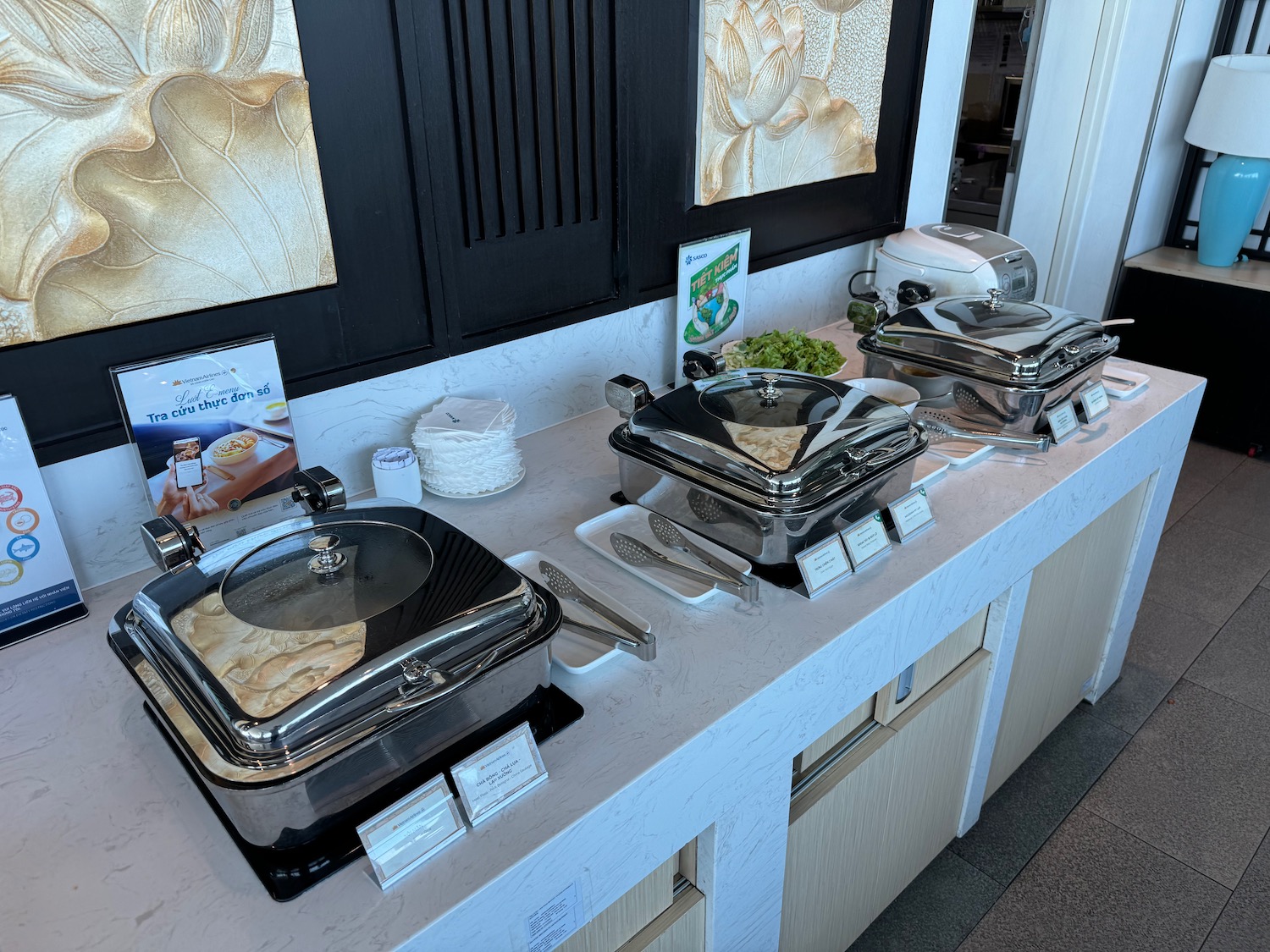 a buffet table with food containers