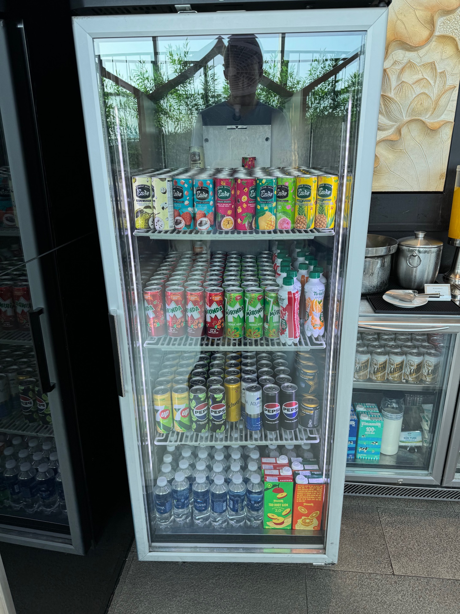 a refrigerator with drinks and cans