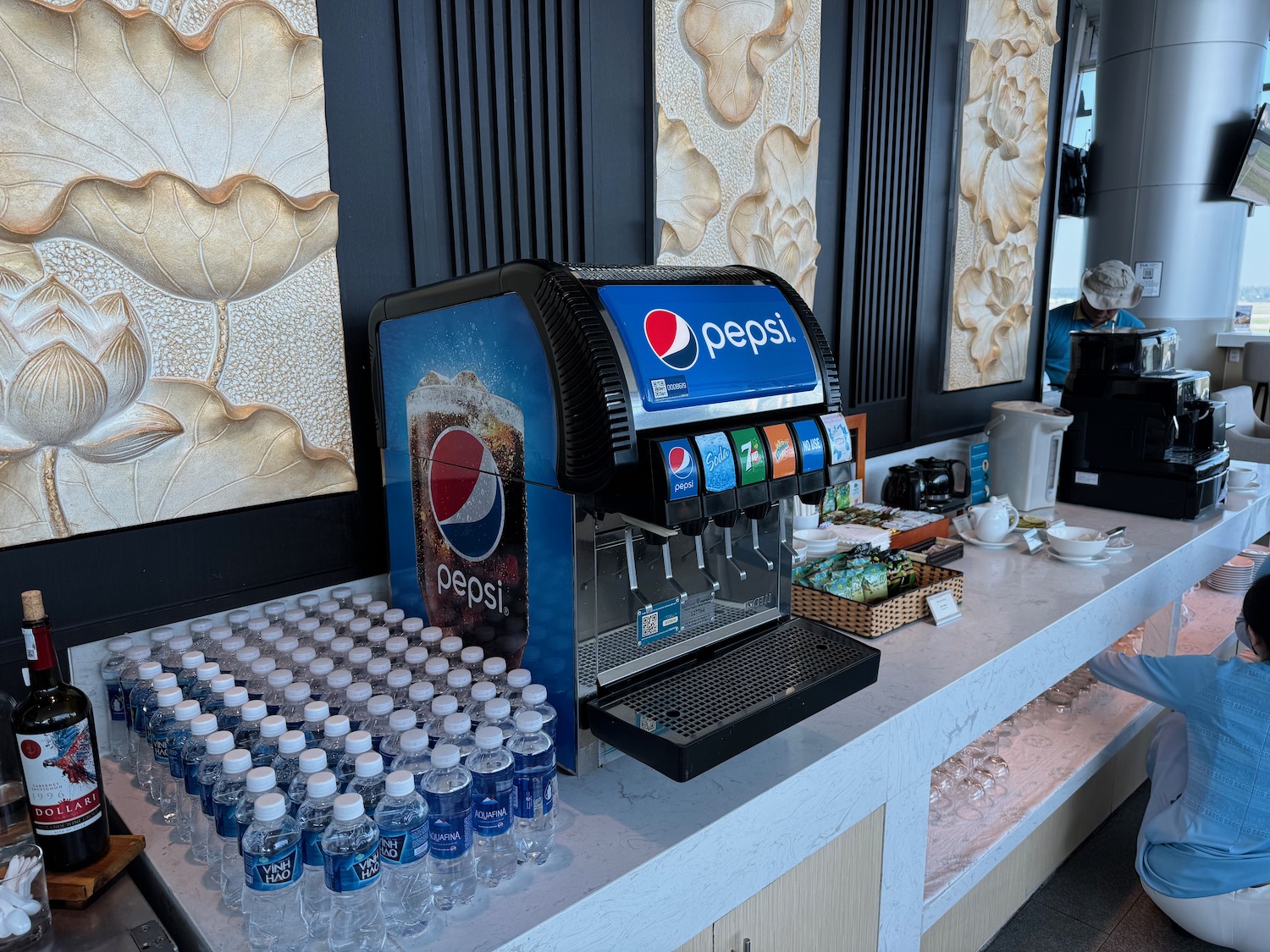 a soda machine and bottles of water