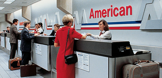 a woman in a red dress at a check-in counter