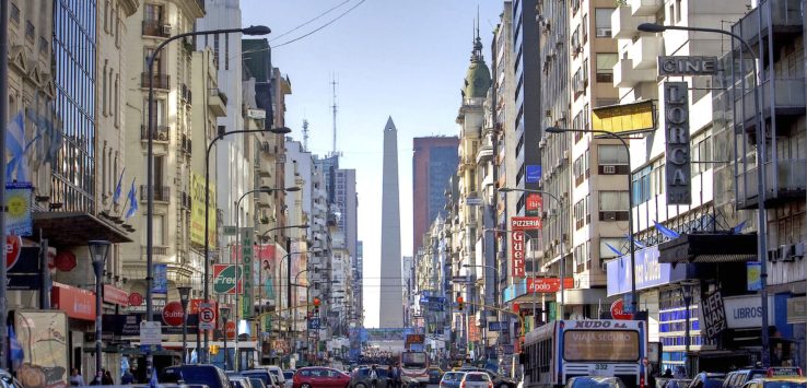 a street with cars and buildings