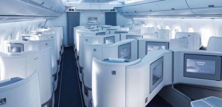 a row of white monitors in a plane