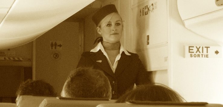 a woman in uniform standing in a room