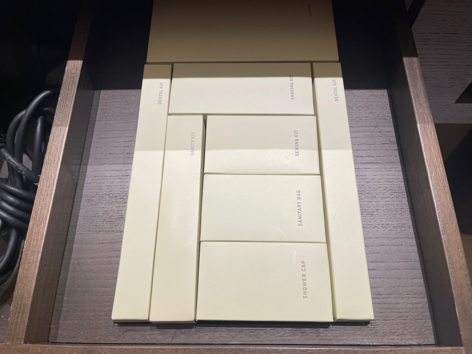 a group of white boxes in a drawer