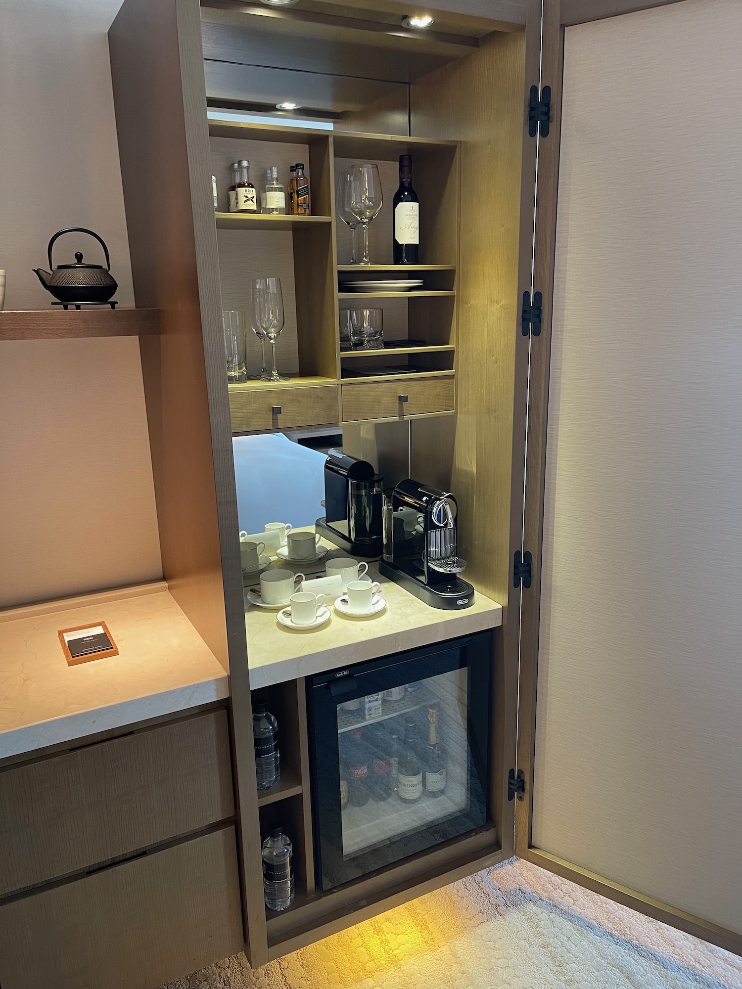 a kitchen with a cabinet and a coffee machine