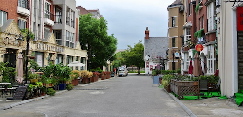 a street with trees and buildings