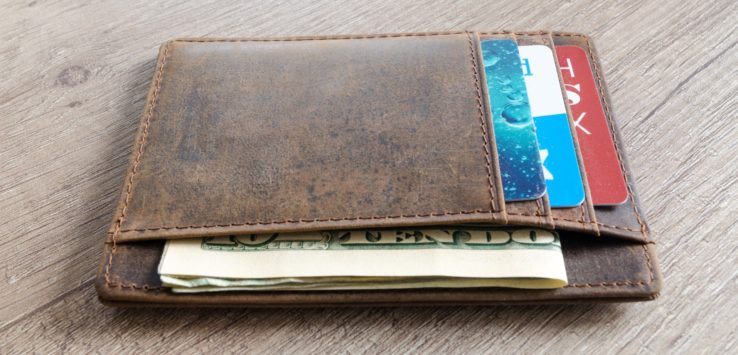 a wallet with money and credit cards