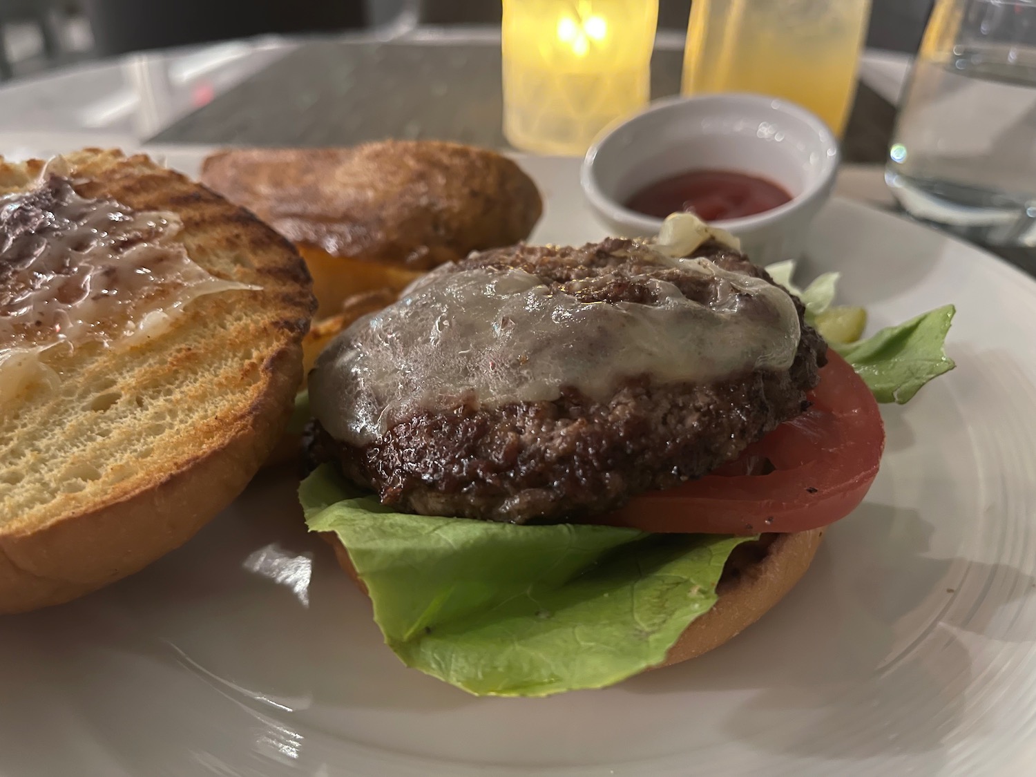 a plate of food with a burger and a toast