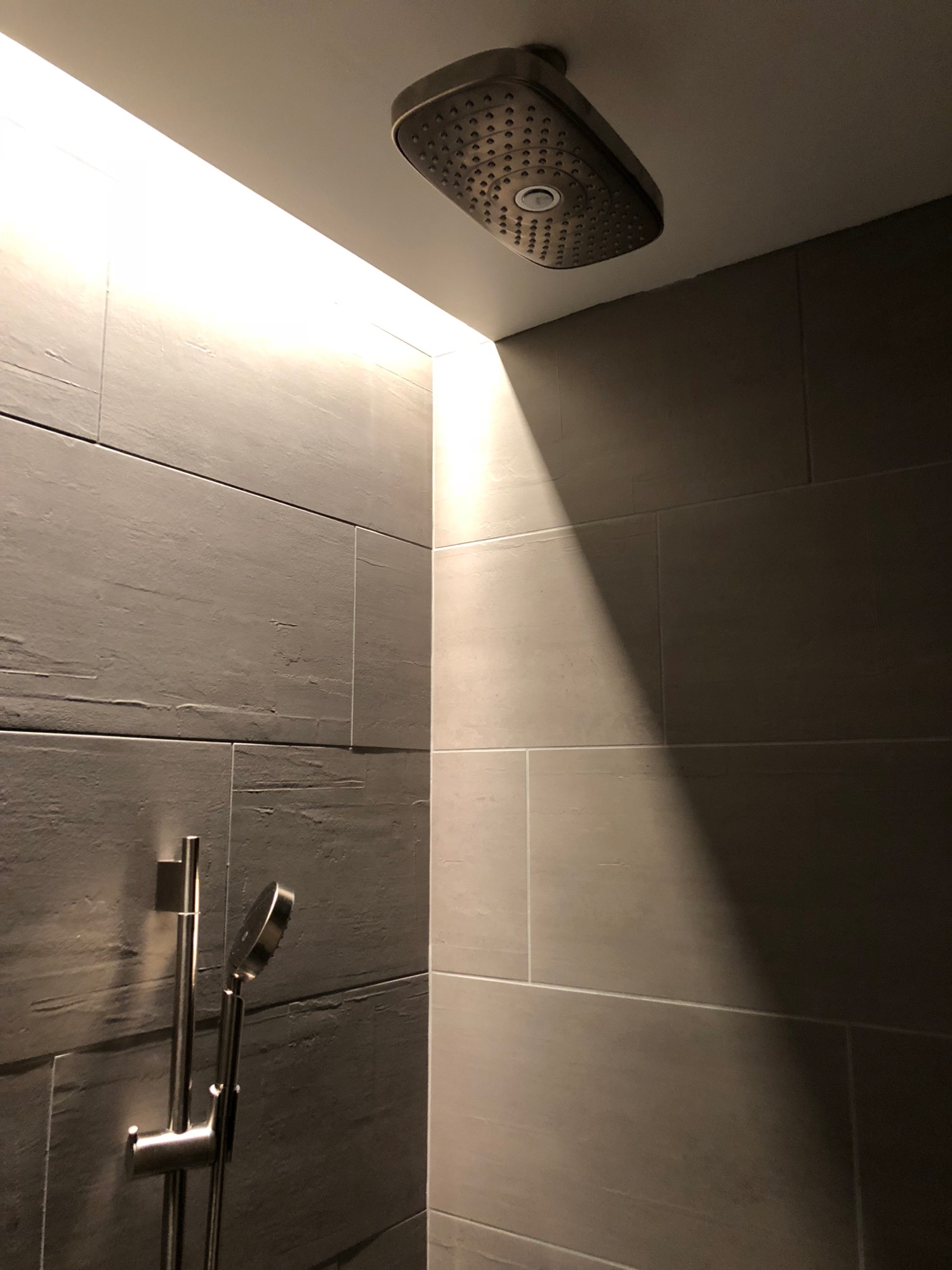 a shower head in a bathroom