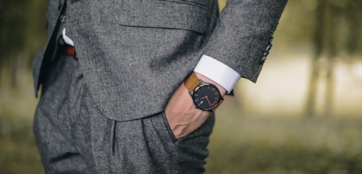 a man wearing a suit and watch