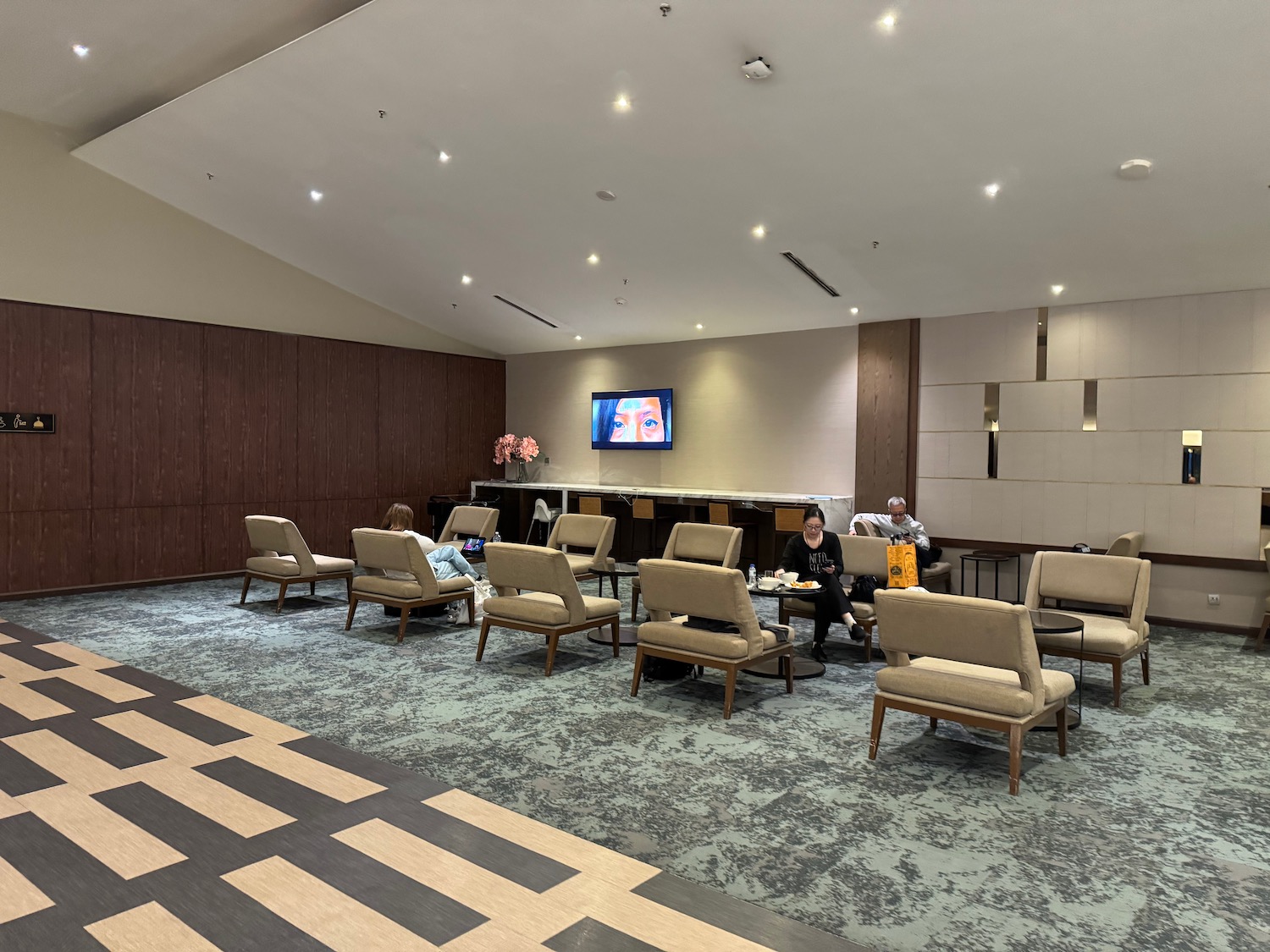 a room with a television and chairs