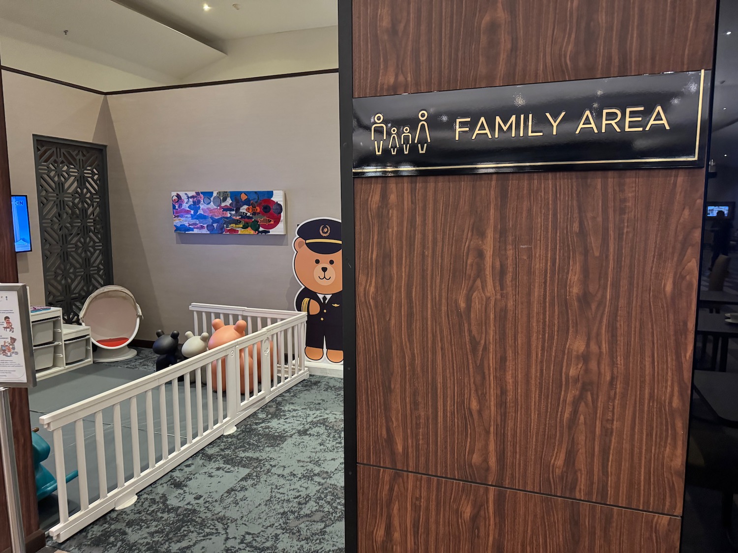 a room with a baby crib and a sign