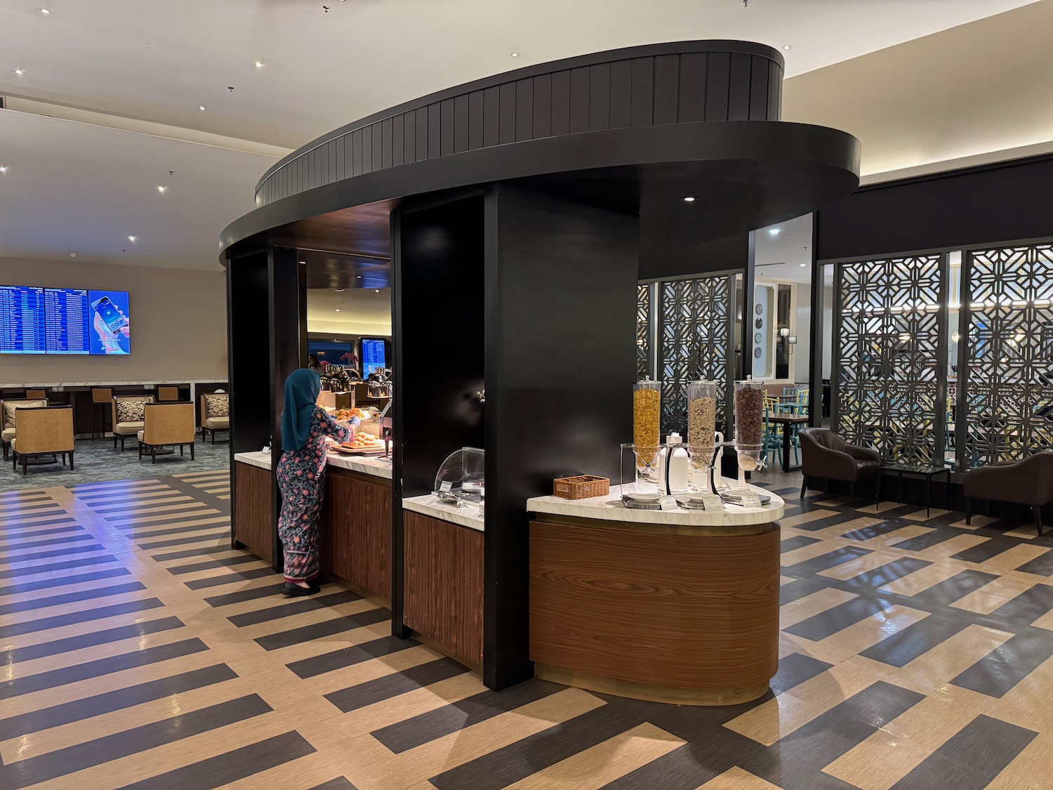 a woman standing at a buffet