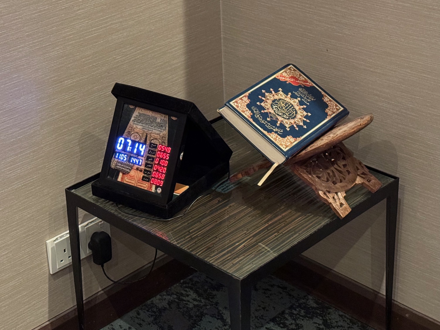 a book and a clock on a table