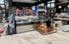 a man and woman behind a counter