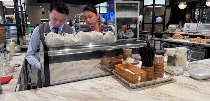 a man and woman behind a counter