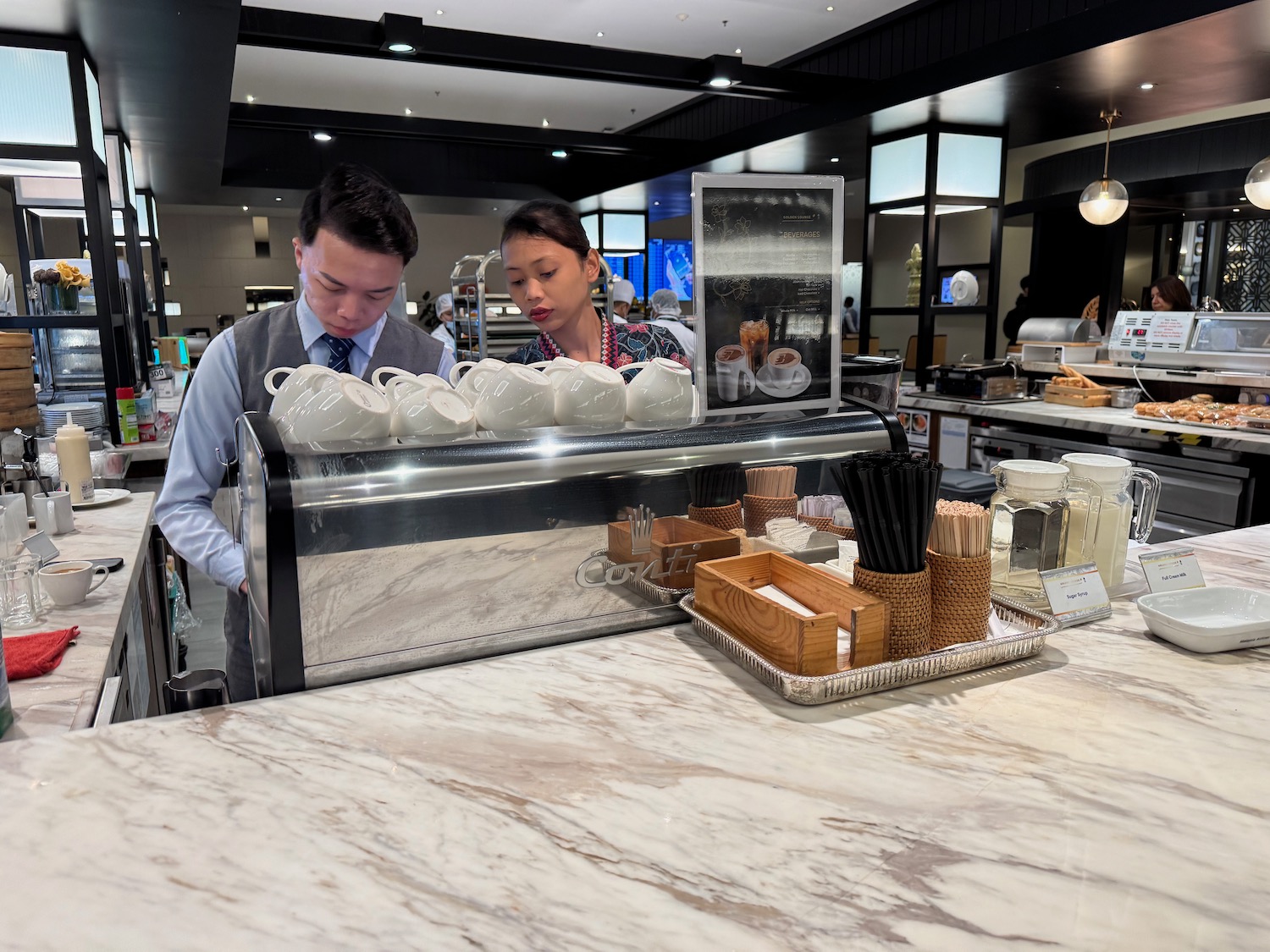 a man and woman behind a counter