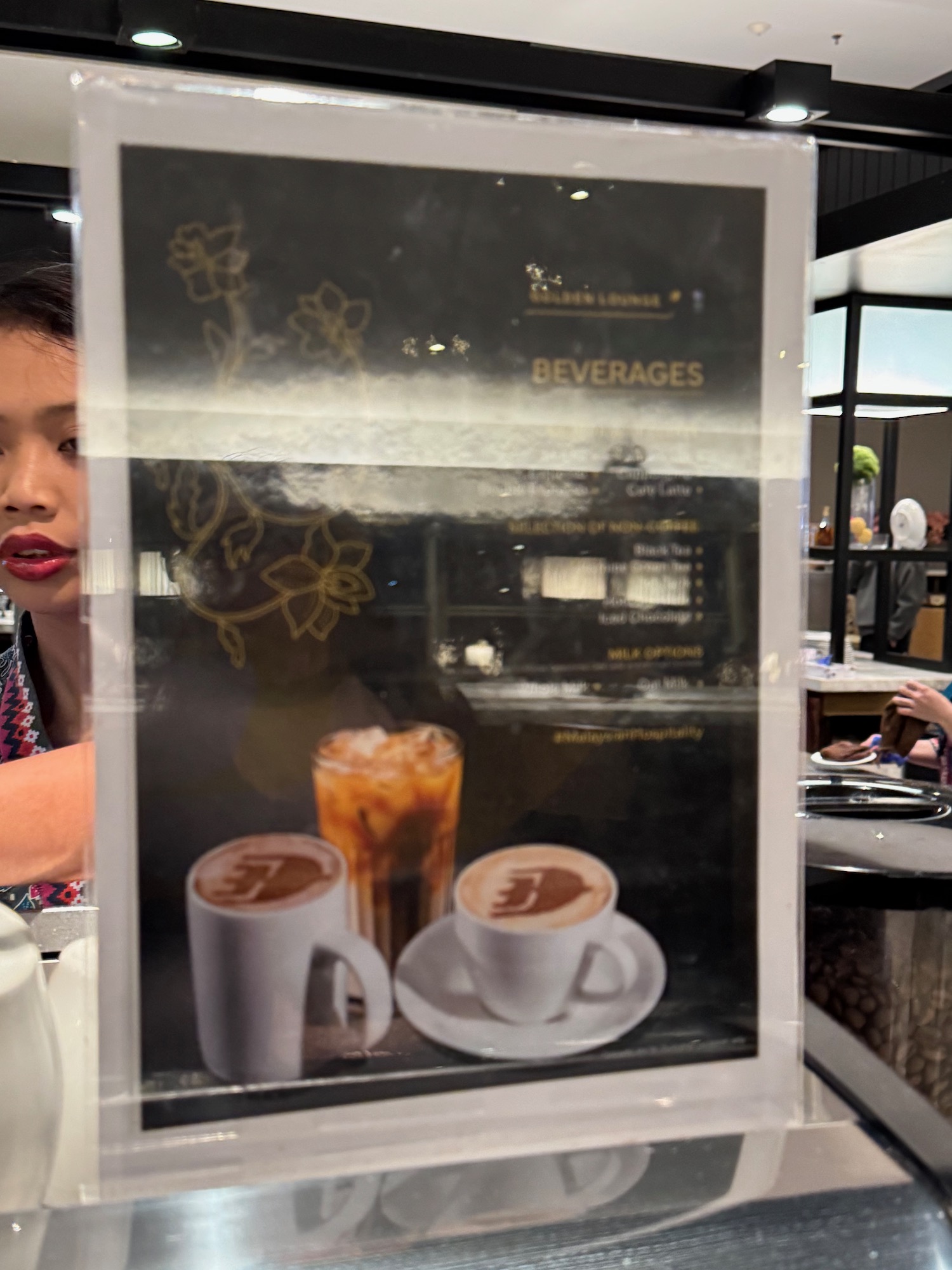 a woman behind a menu