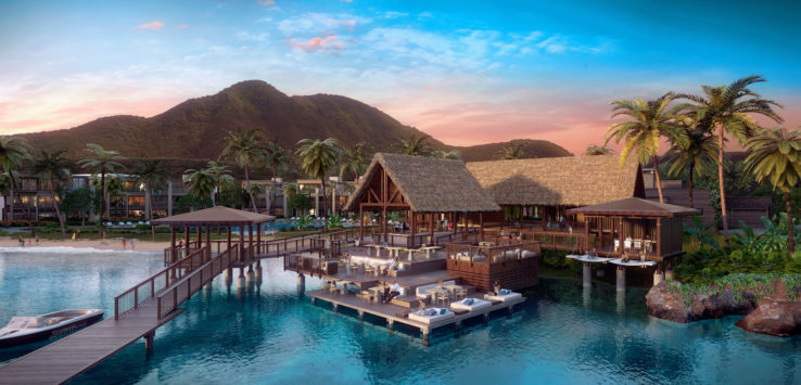 a resort with a pool and a mountain in the background