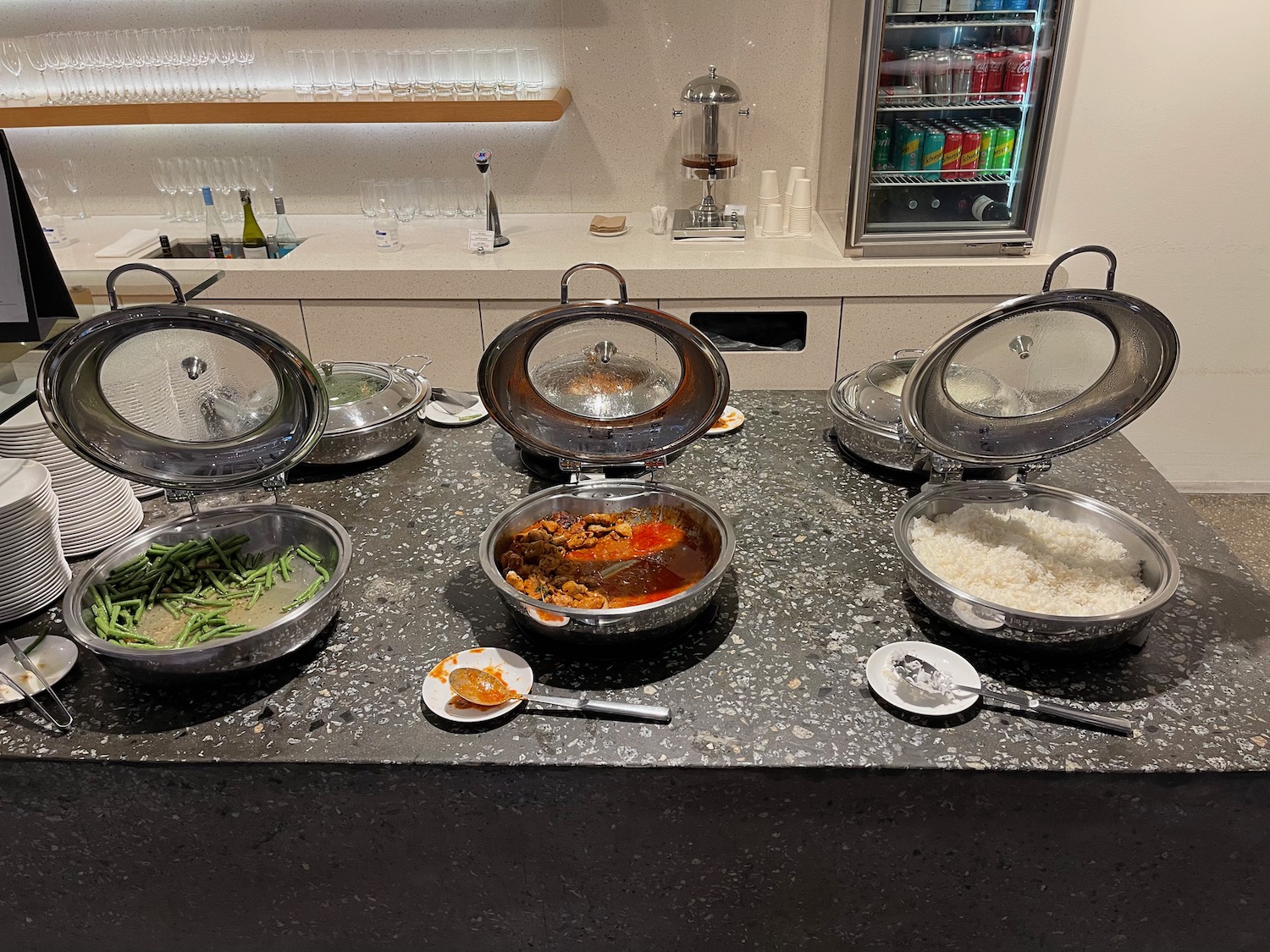 a group of bowls with food on a table