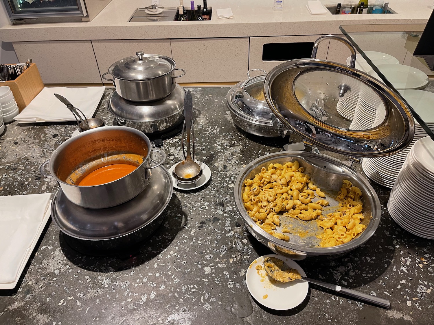 a table with pots and pans of food