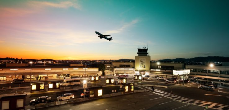 an airplane flying over a city