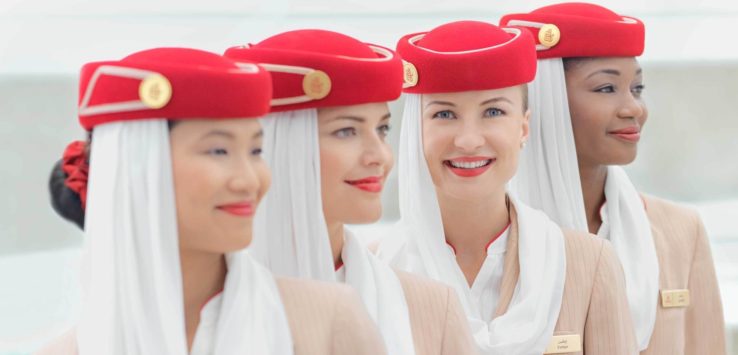 a group of women wearing red hats