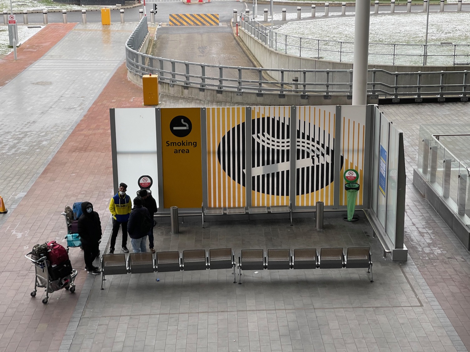 people standing next to a sign