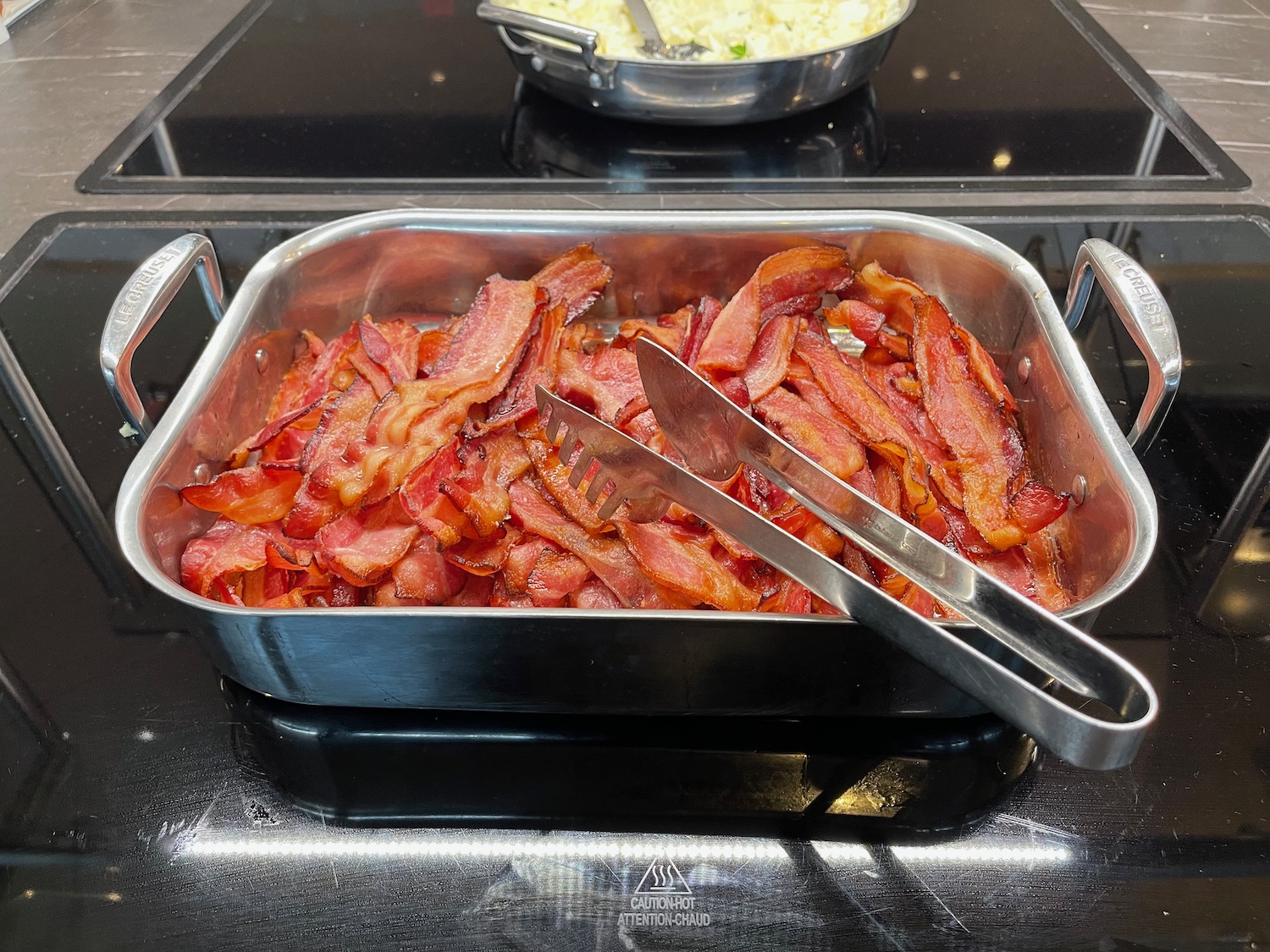 a pan of bacon on a stove