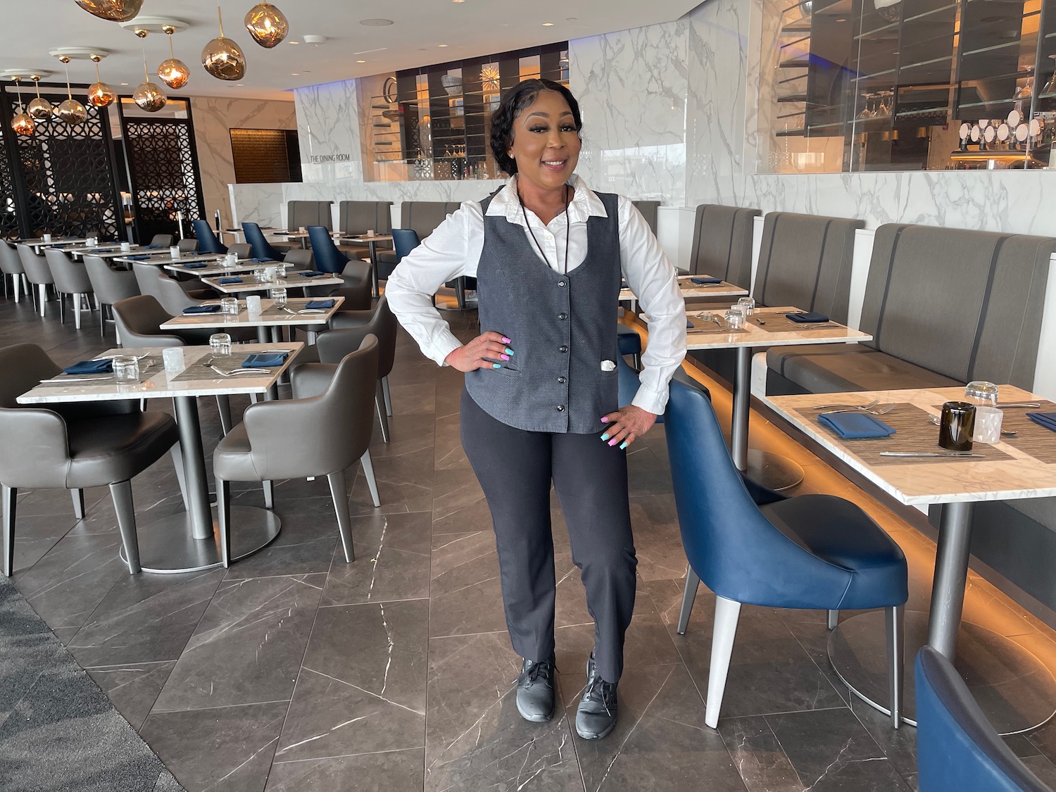 a woman standing in a restaurant