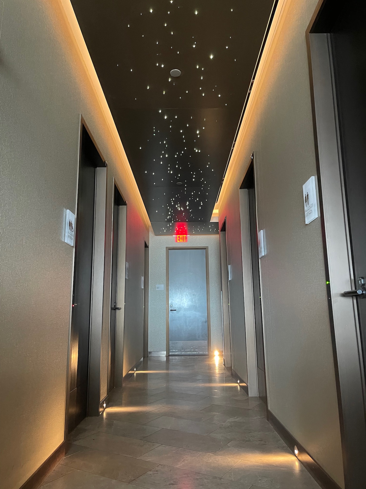 a hallway with lights on the ceiling