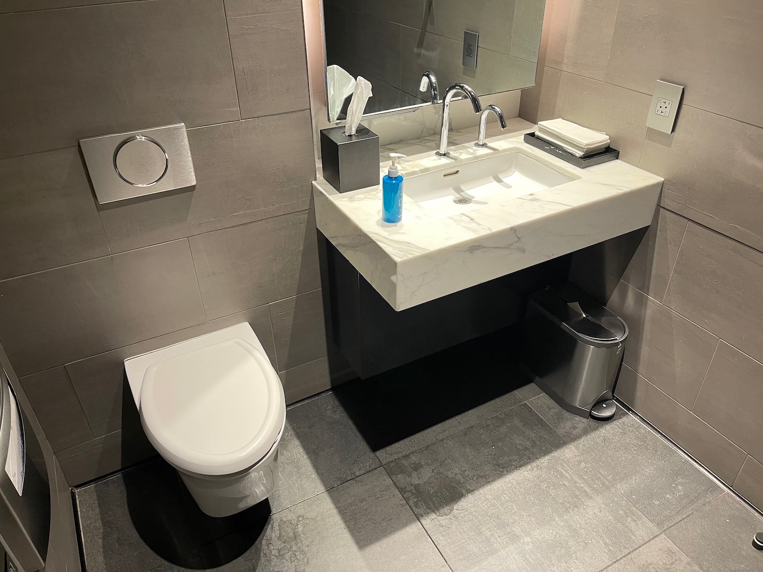 a bathroom with a sink and toilet