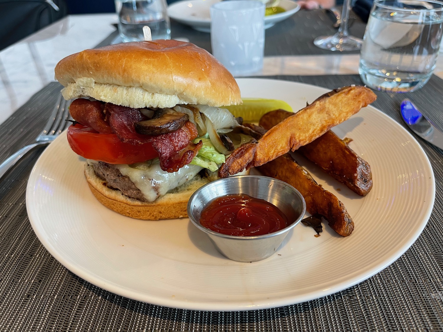 a burger with fries and ketchup on a plate