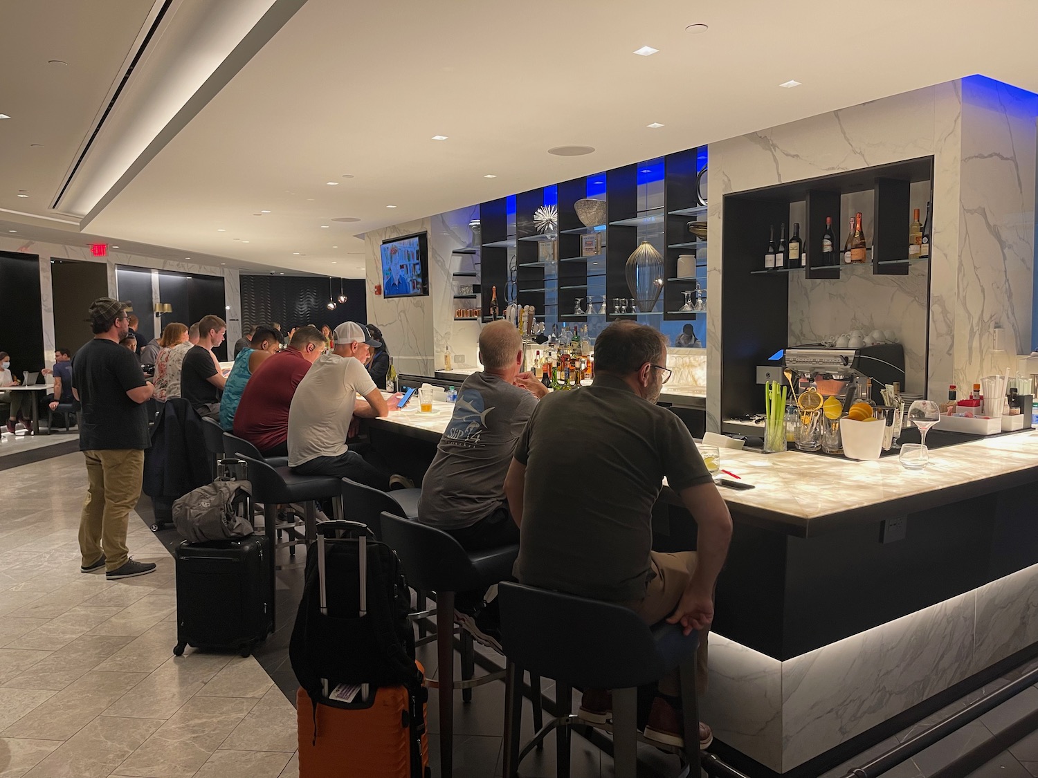 a group of people sitting at a bar