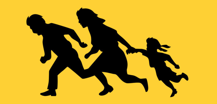 a silhouette of a woman and a child running