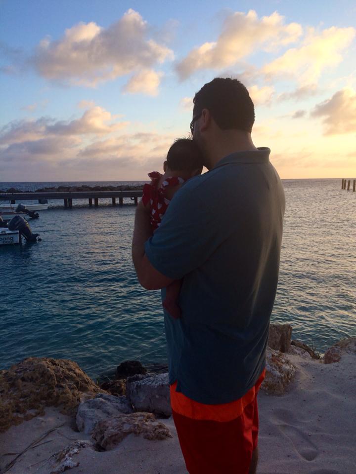 Lucy and I looking out at the Caribbean on her first international trip to Curacao.