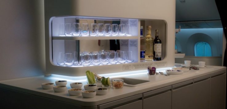 a counter with glasses and food on it