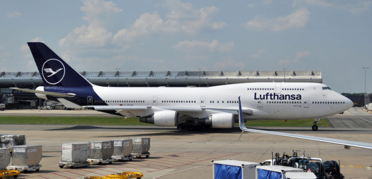 a large white airplane on a runway