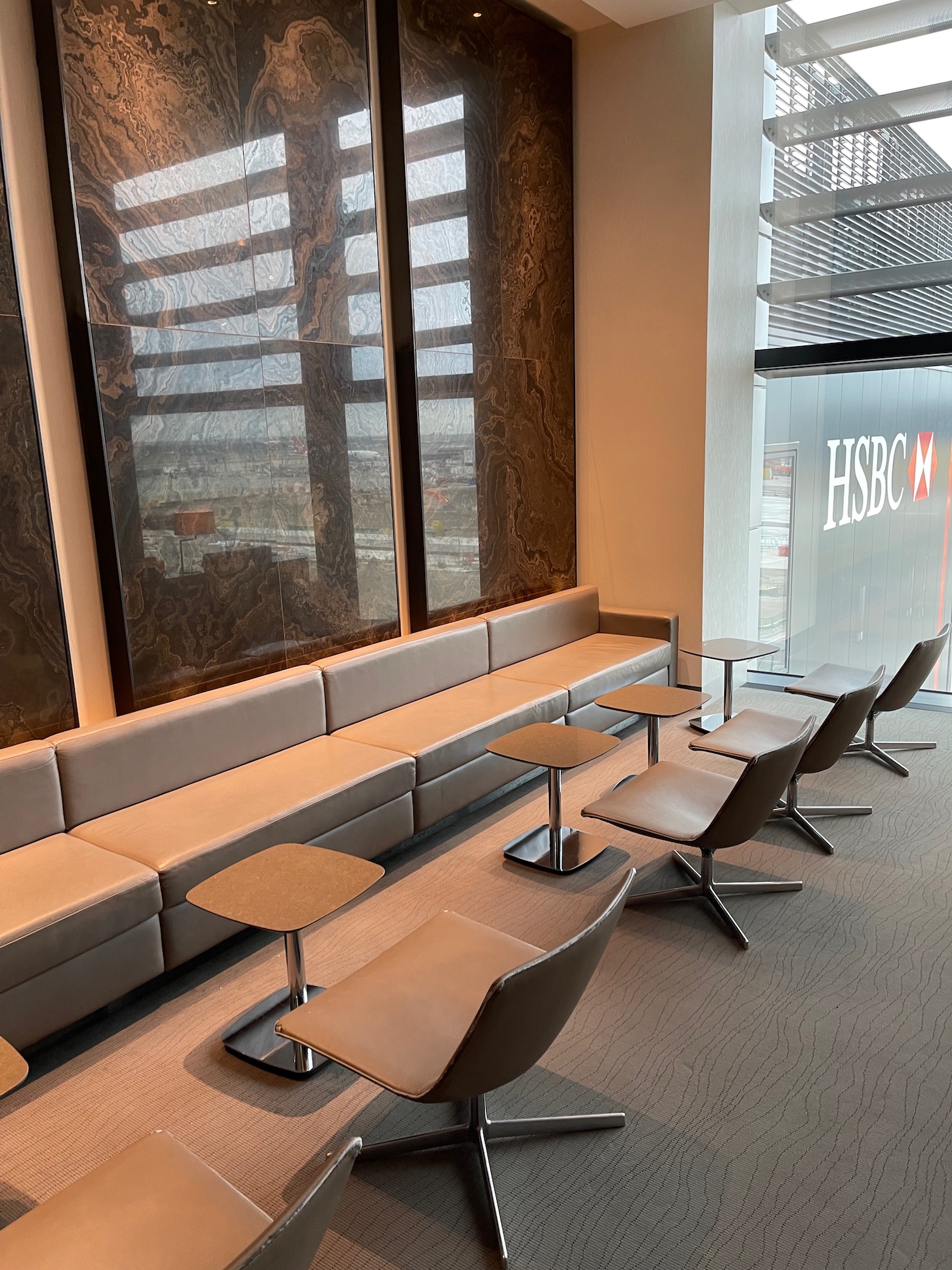 a long couch and chairs in a room