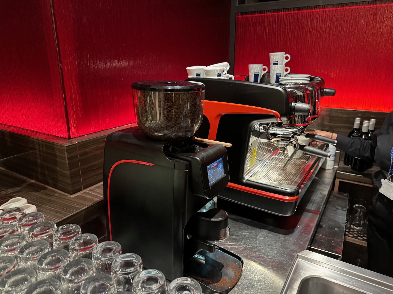 a coffee machine and cups on a counter